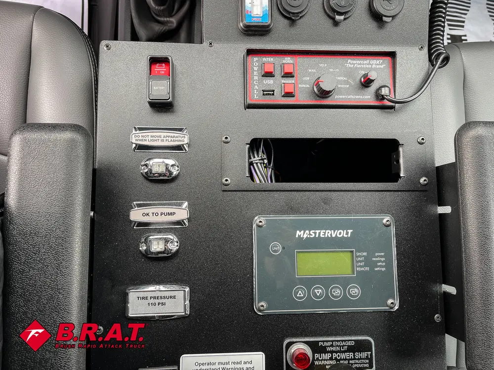 Center switch console with labeled controls and digital display.