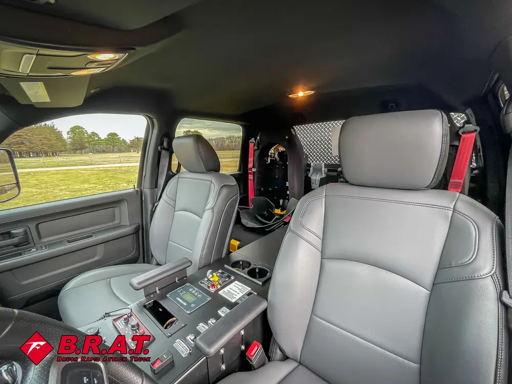 Rear seating area with gray seats and center command console.