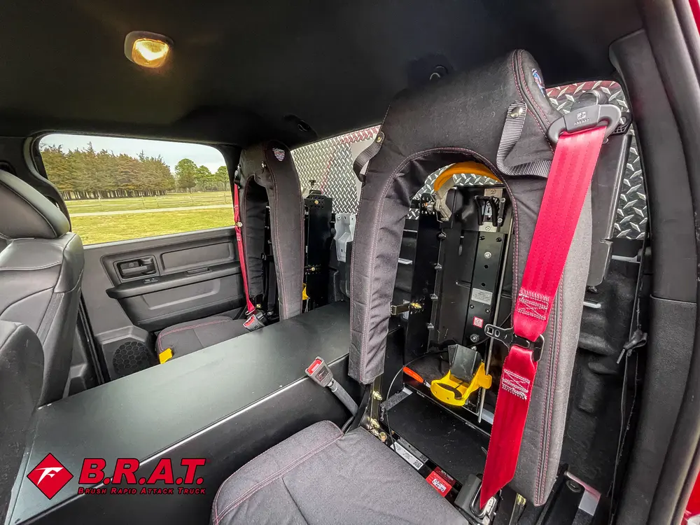 Folded rear seat exposing mounted breathing apparatus and harness.