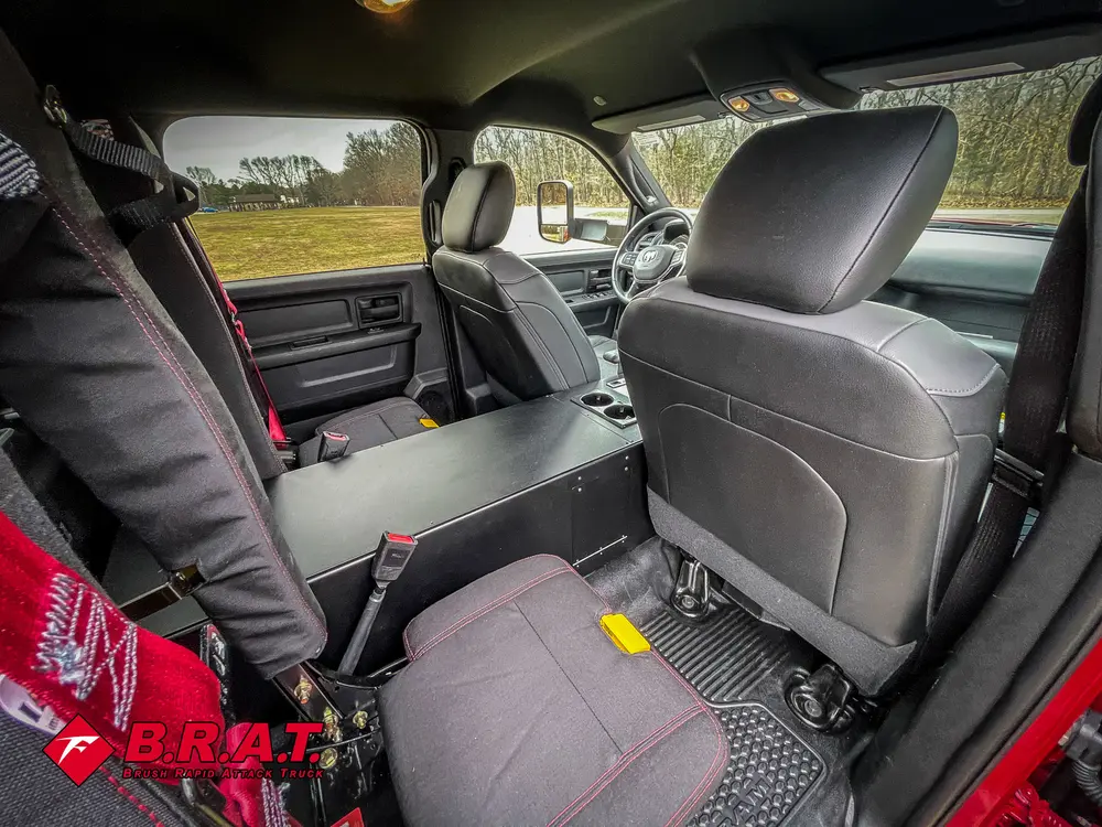 Rear passenger area with fold-up seat and step entry visible.