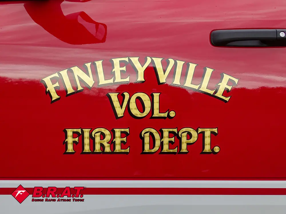 Gold 'Finleyville Vol. Fire Dept.' lettering on red body panel.