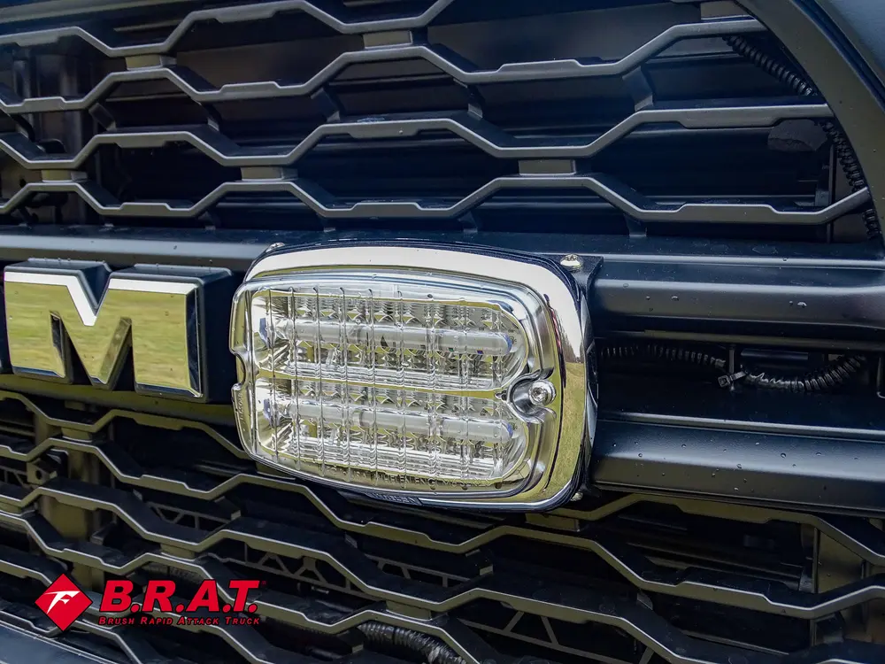 Grille close-up with mounted rectangular warning light.