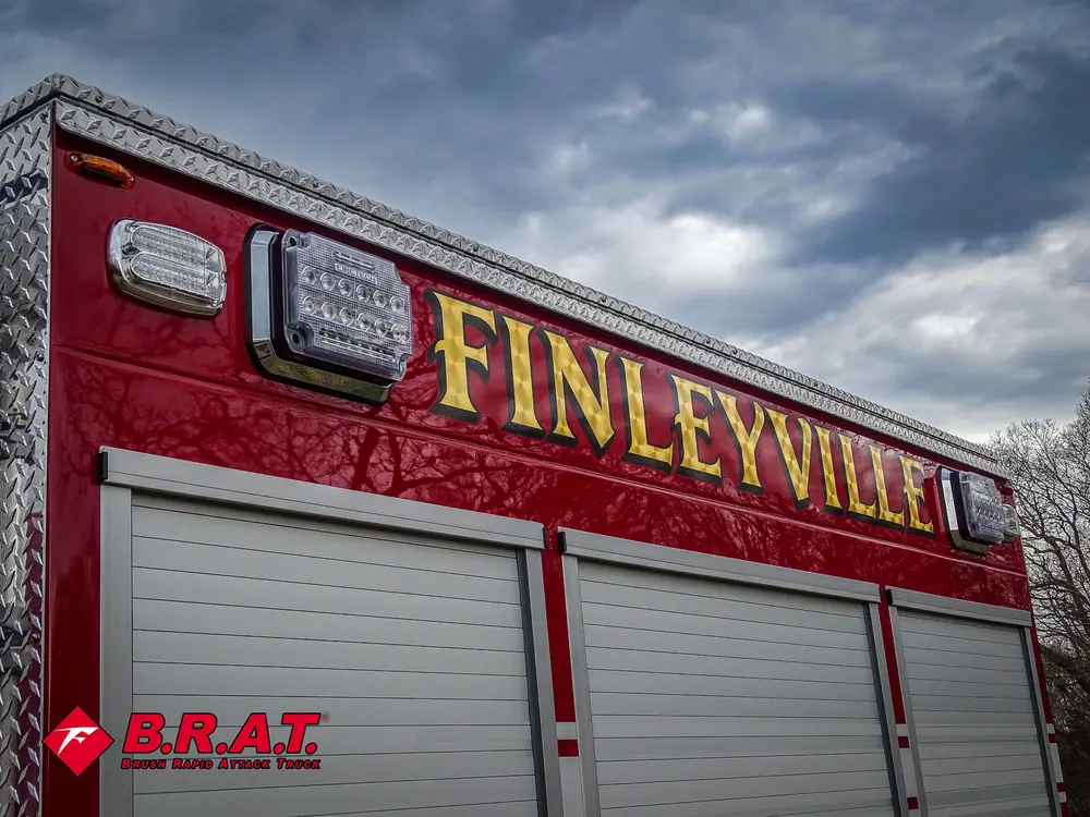 Upper side lettering and roll-up compartment door close-up.