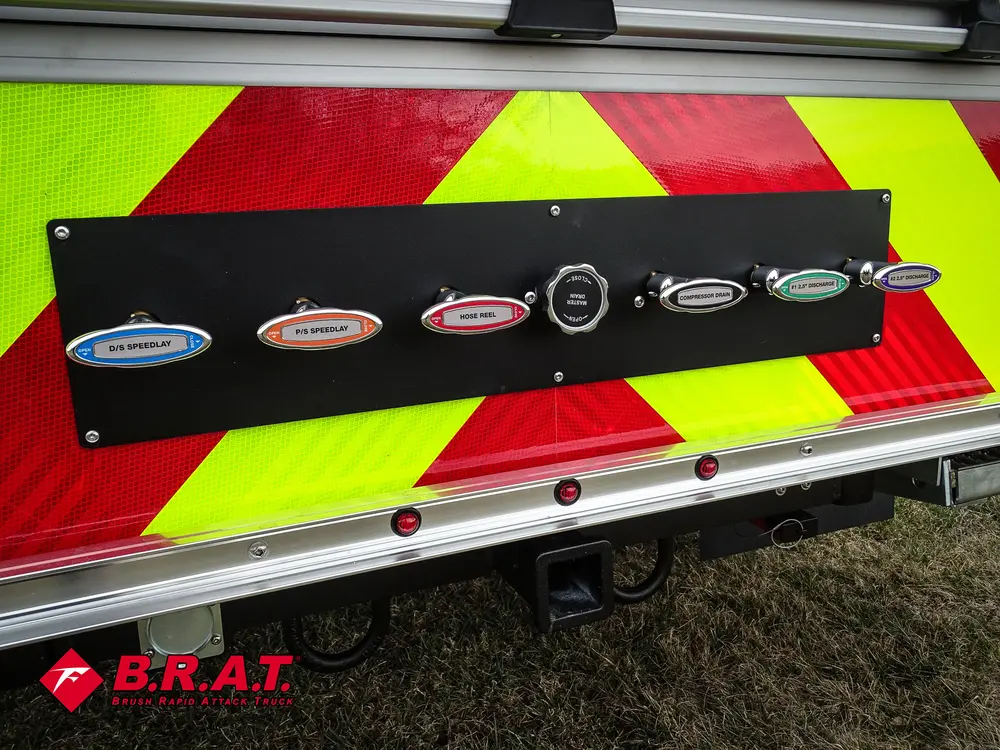 Lower rear panel close-up with labeled discharge/connection ports.