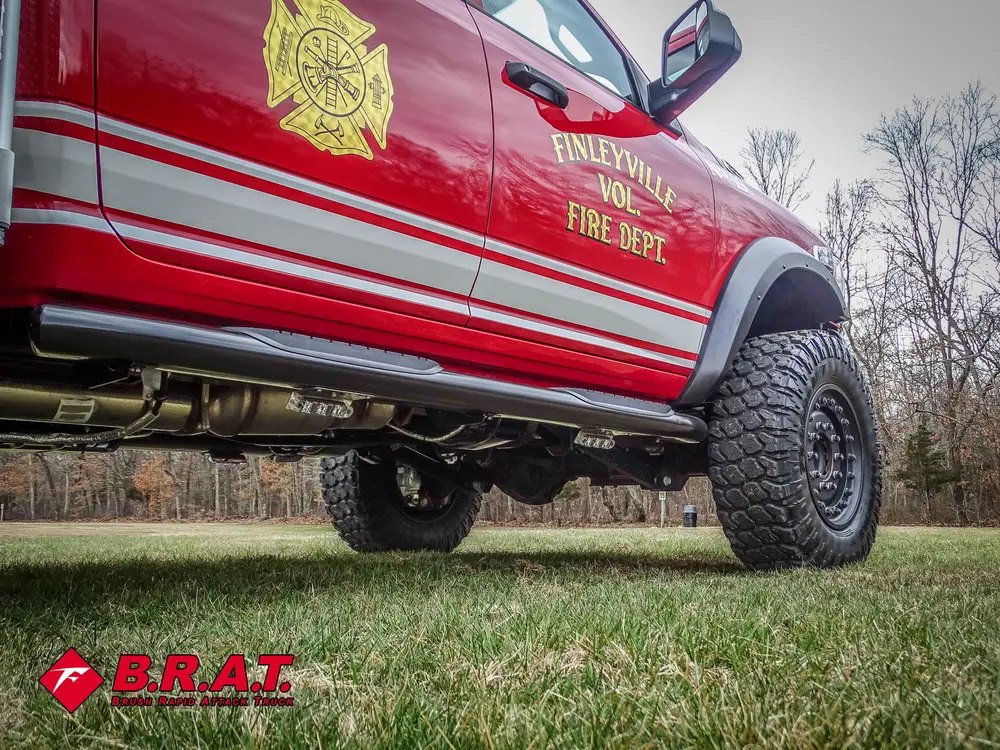 Driver-side lower body and undercarriage side view.