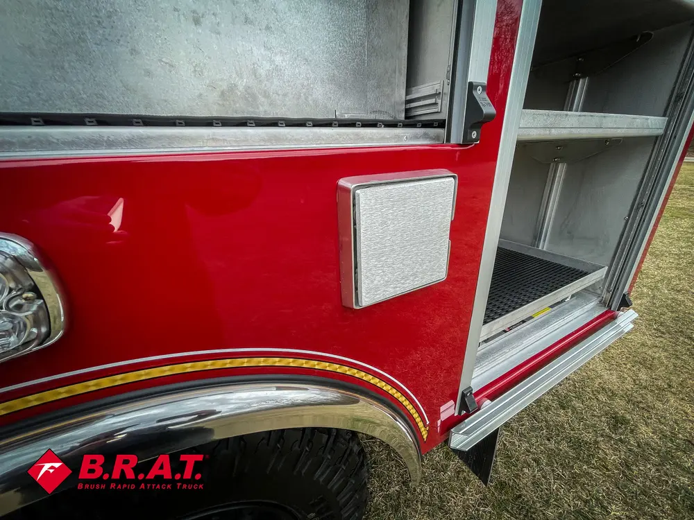 Small side access panel closed near open shelf compartment.