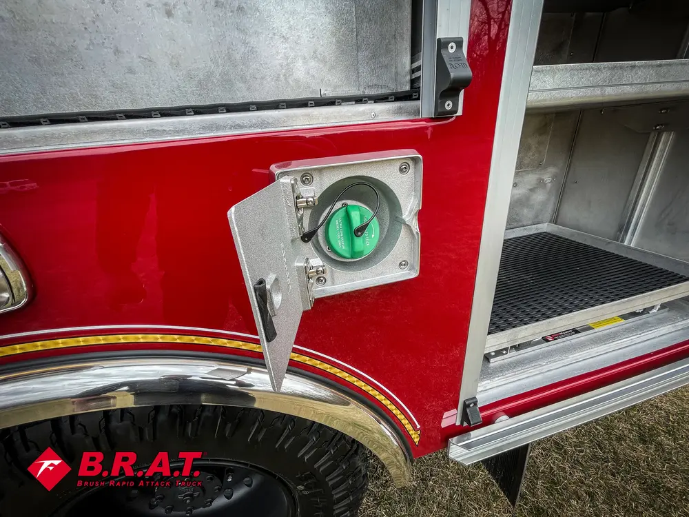 Open side intake-port hatch showing green-capped fitting.