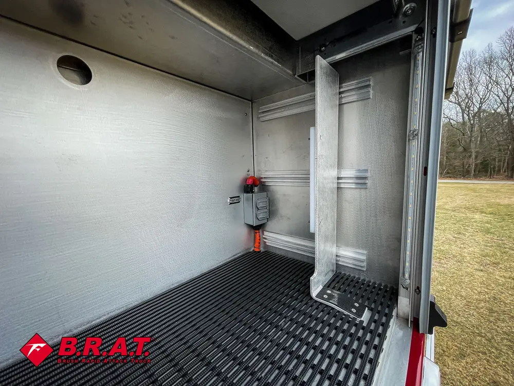 Open side bay with mounted fitting and empty floor area.