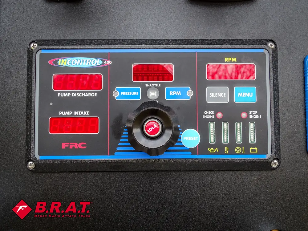 Engine/pump control module close-up with buttons and status indicators.