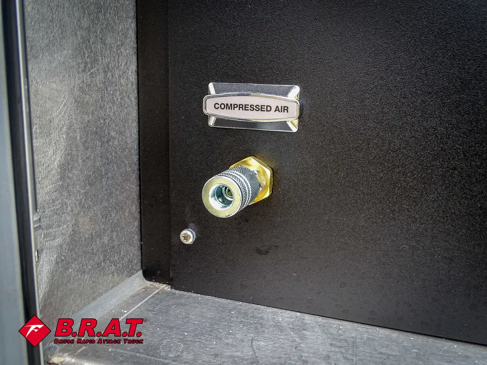 Compressed air fitting close-up inside dark side panel.