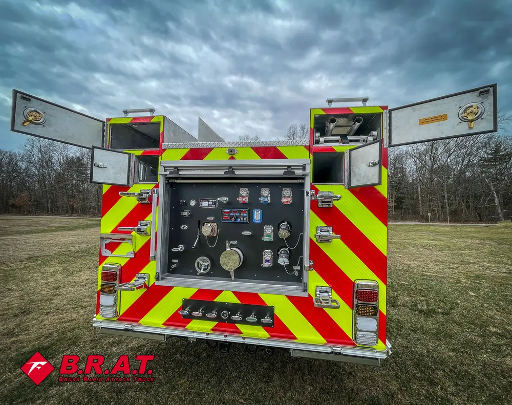 Rear view with top doors opened outward around pump panel.