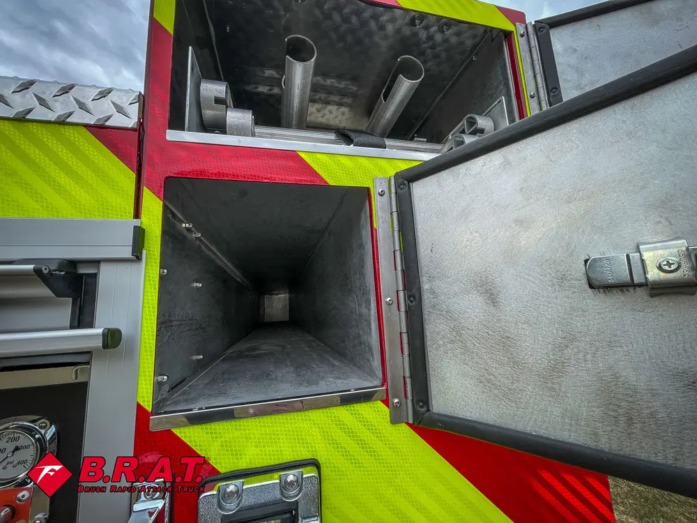 Narrow rear upper compartment open with pipe/roller assembly.