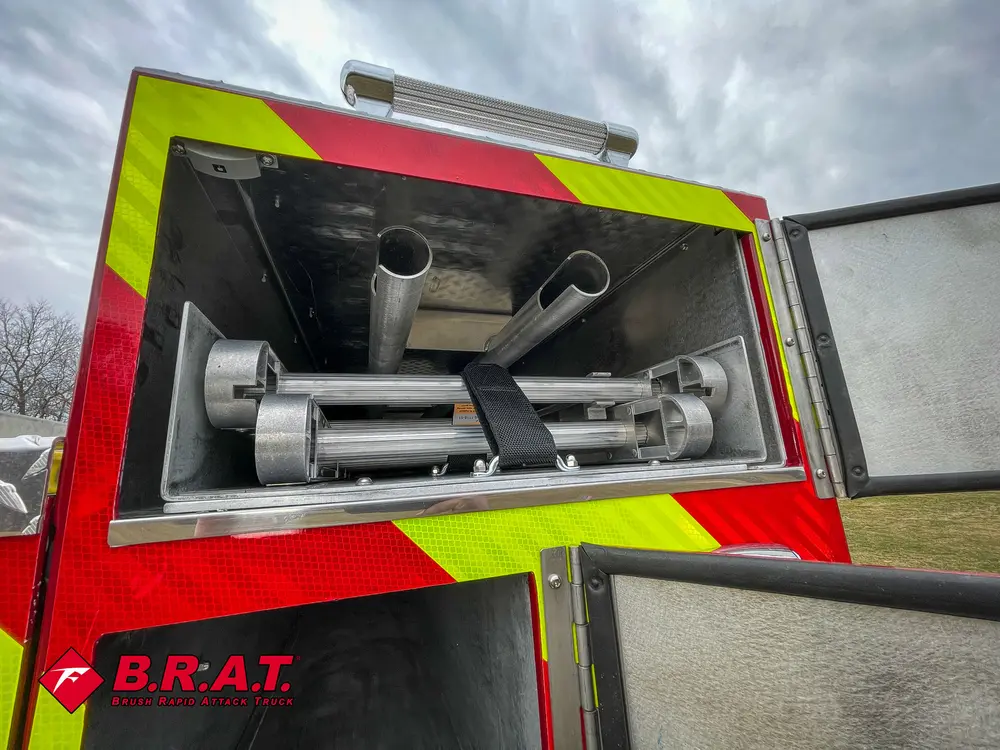 Rear upper bay close-up with metal roller and pipe hardware.