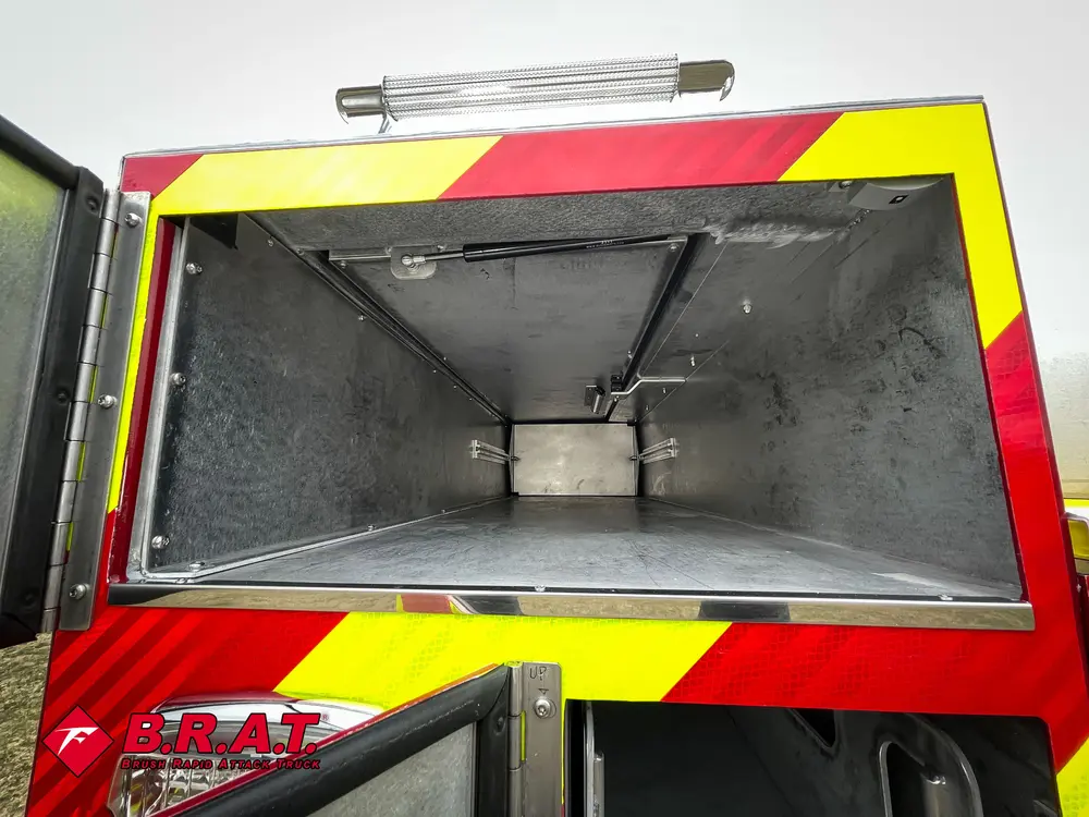 Open tapered rear compartment with smooth metal interior.