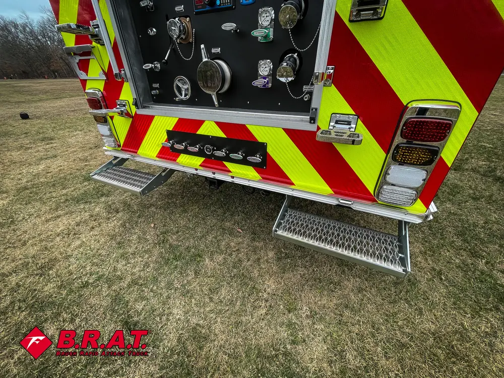 Rear-right corner view with lower fold-down step and open panel.