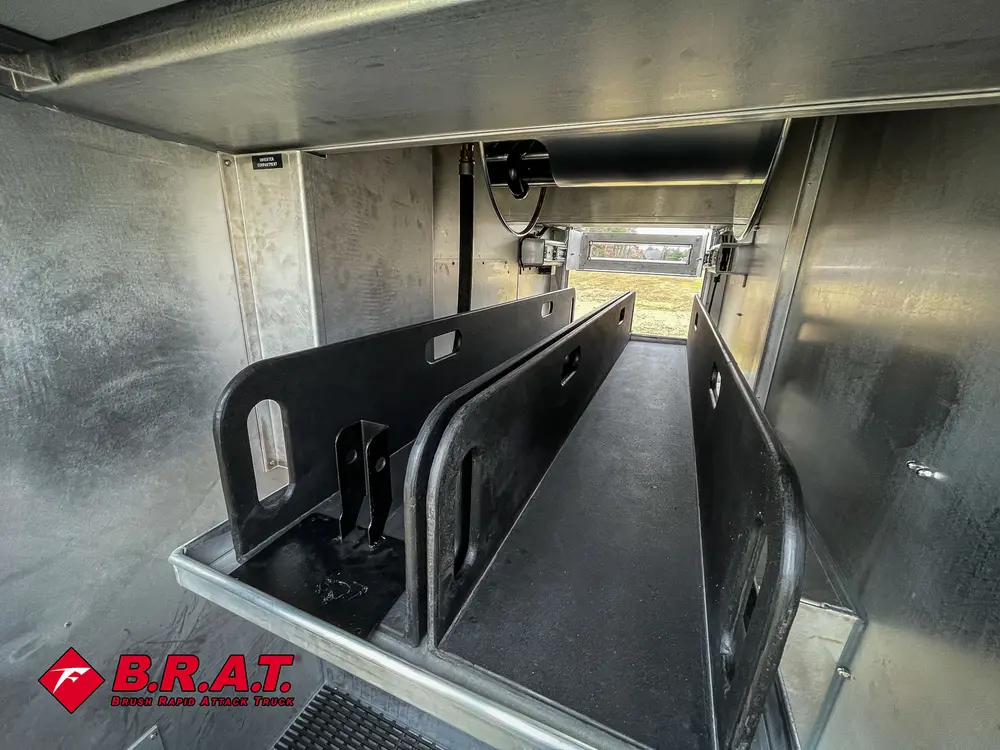 Close-up inside pump bay showing black divider plates and piping.