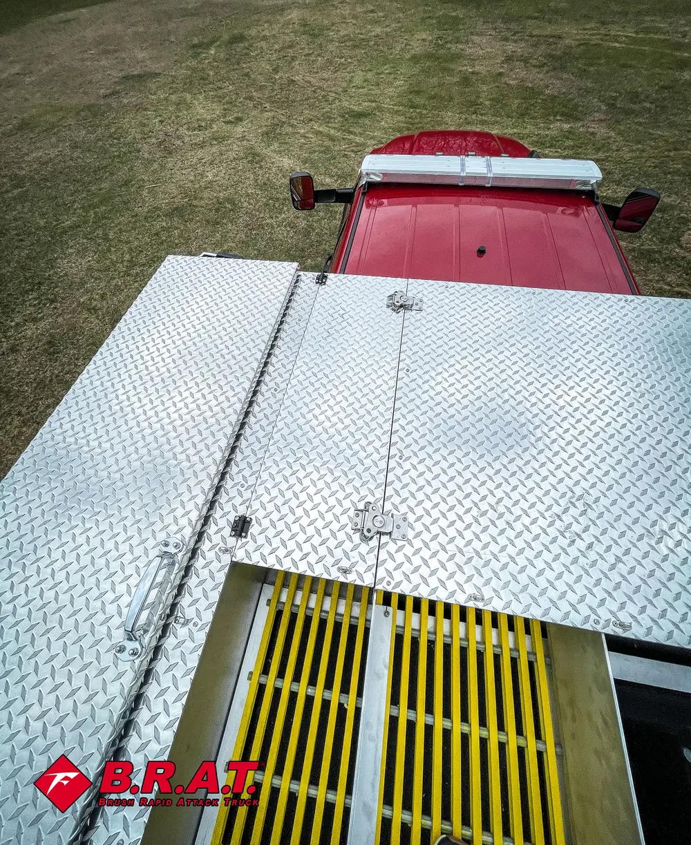 Closed rear deck lids over the yellow grated channel.