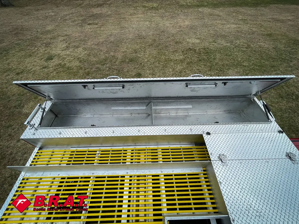 Open long top compartment with yellow grate visible below.