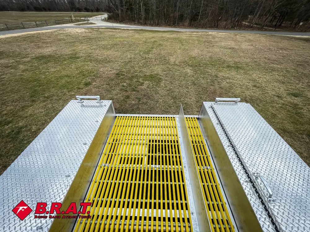 Rear platform view with yellow anti-slip grate between side walkways.