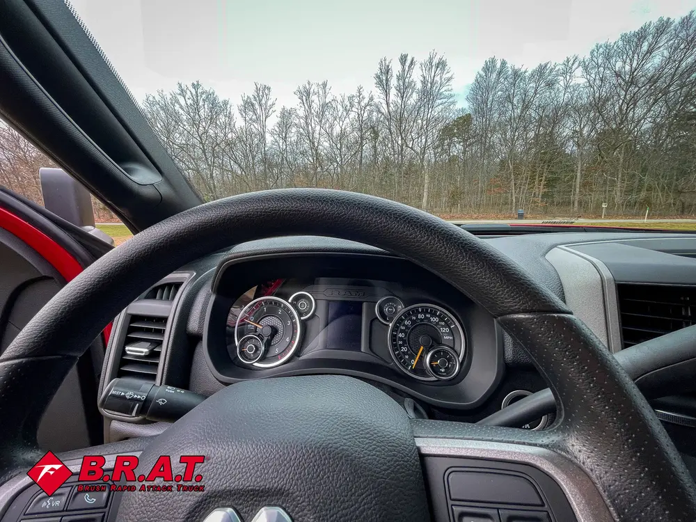 Driver perspective of steering wheel, gauges, and instrument cluster.