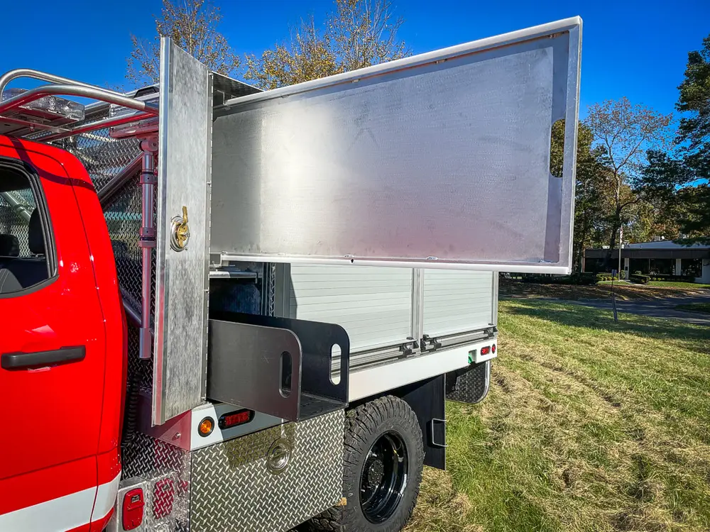 Long side compartment open with shelves and fold-out door.