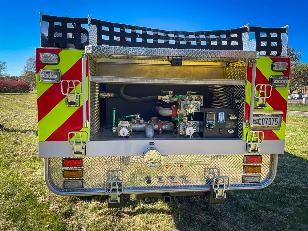 Straight rear view with open pump panel and chevron corners.