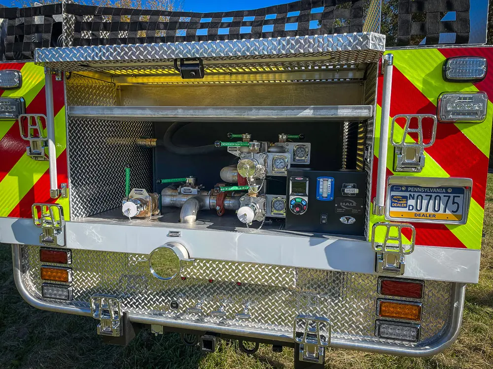 Rear pump panel close-up with controls and plumbing.