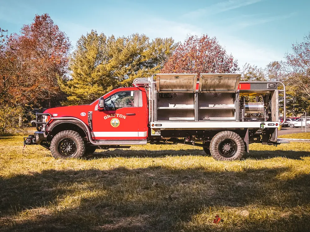 Right-side profile with multiple side compartments open.