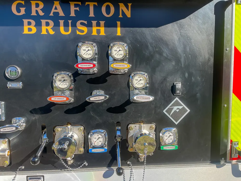 Pump panel section with gauges and discharge valves.