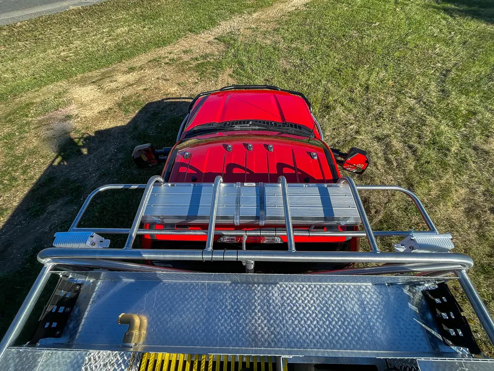 Top deck near cab showing handrails and red cab roof.