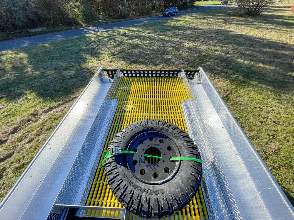 Top deck view with spare tire and yellow center walkway.
