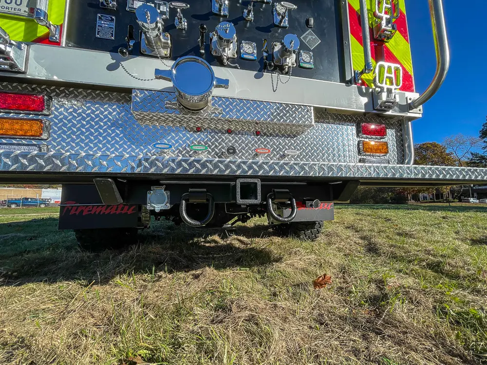 Rear view close-up of tow hitch area and lower step assembly.