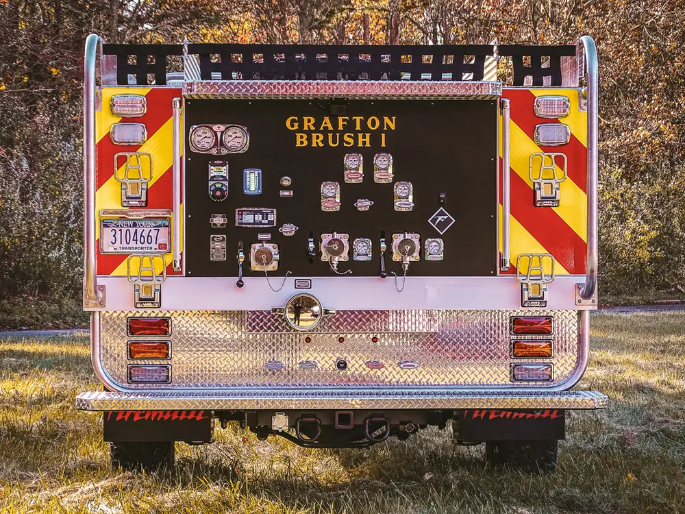 Straight rear view of pump panel with chevron-striped corners.