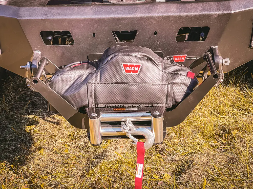 Front bumper close-up showing Warn winch assembly and fairlead.