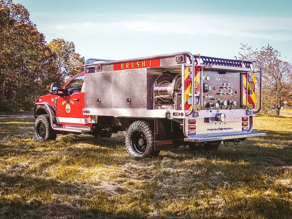 Rear-right three-quarter view with open rear equipment area.