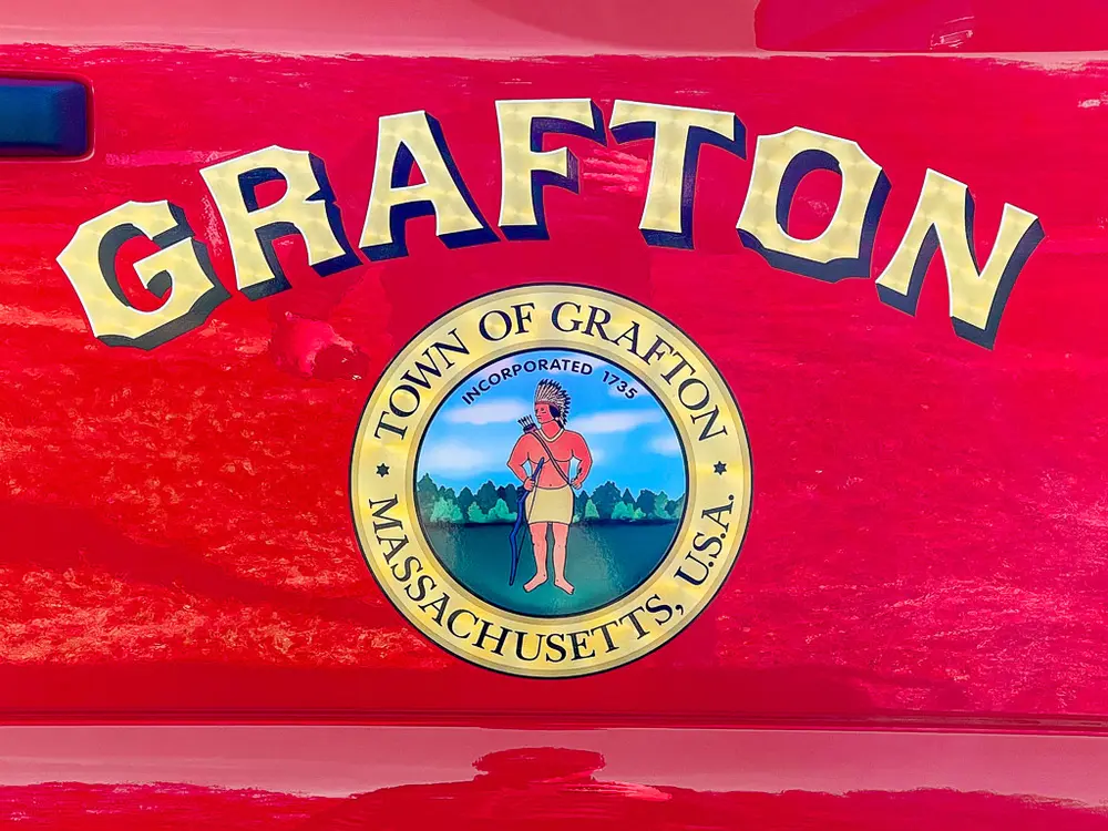 Door emblem close-up reading Grafton with town seal beneath lettering.