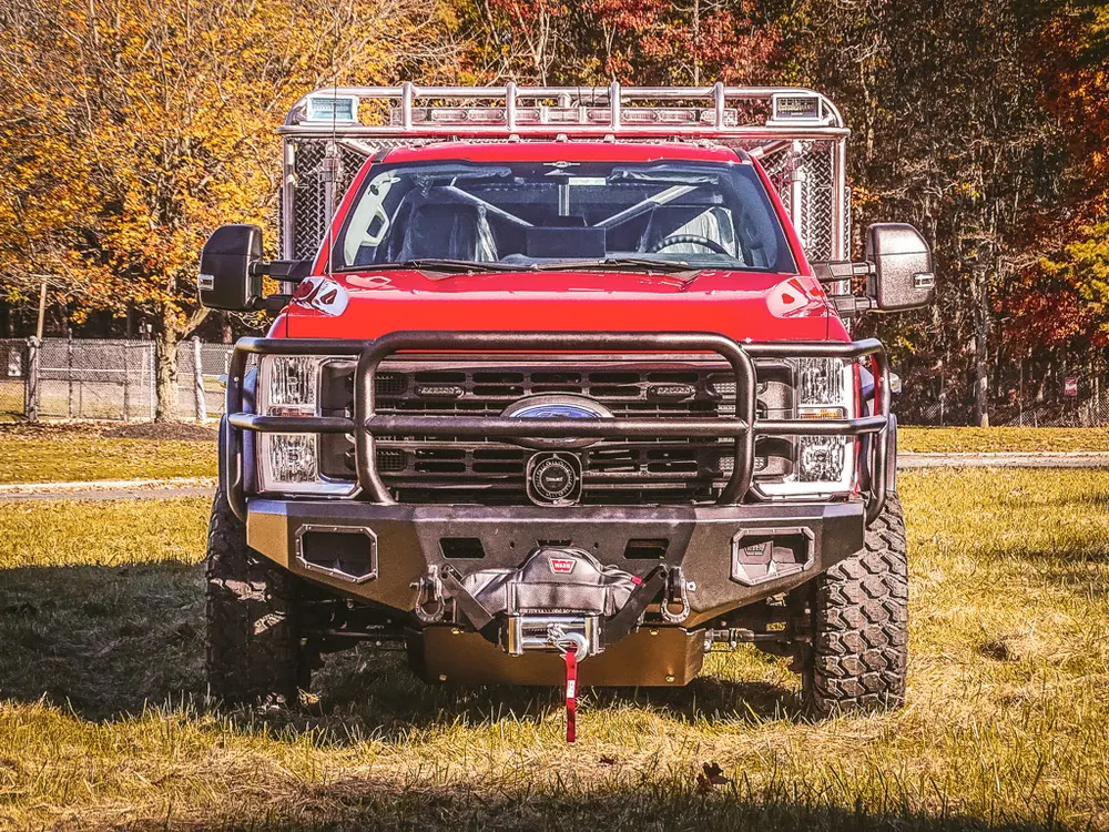 Head-on front view showing grille guard and front bumper winch.