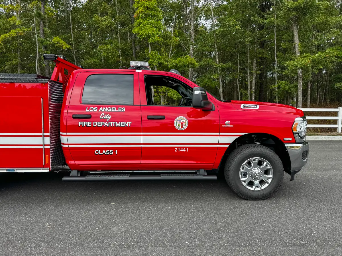 Driver-side cab close view with LAFD door insignia.