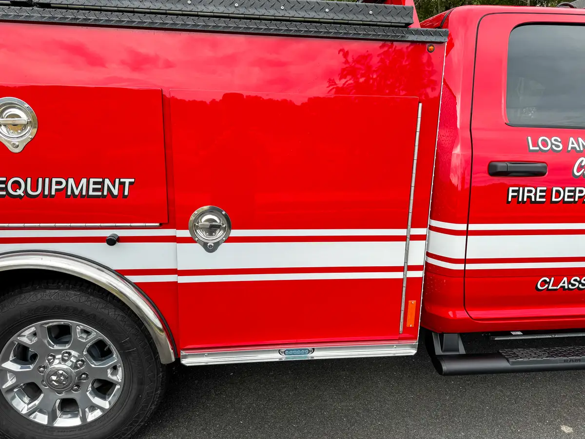 Side body panel close-up with heavy equipment labeling.