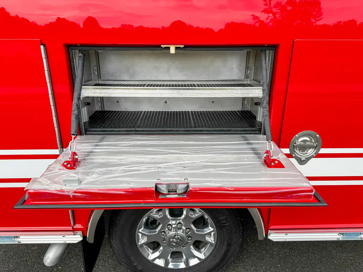 Open drop-down shelf compartment on side body.