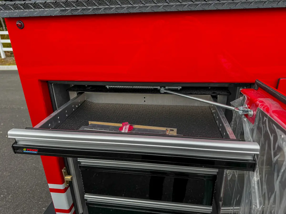 Open slide-out drawer with shallow shelf insert.