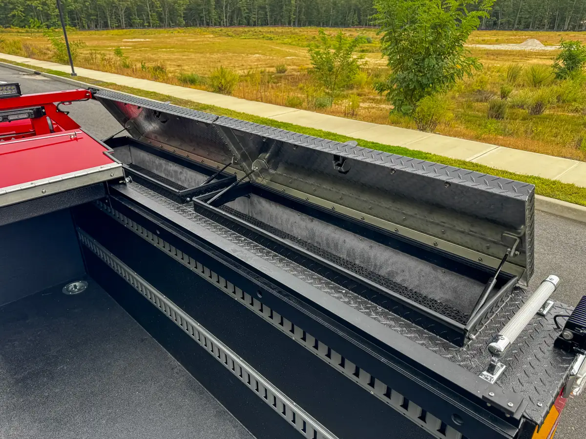 Open side rail storage channel with internal partitions.