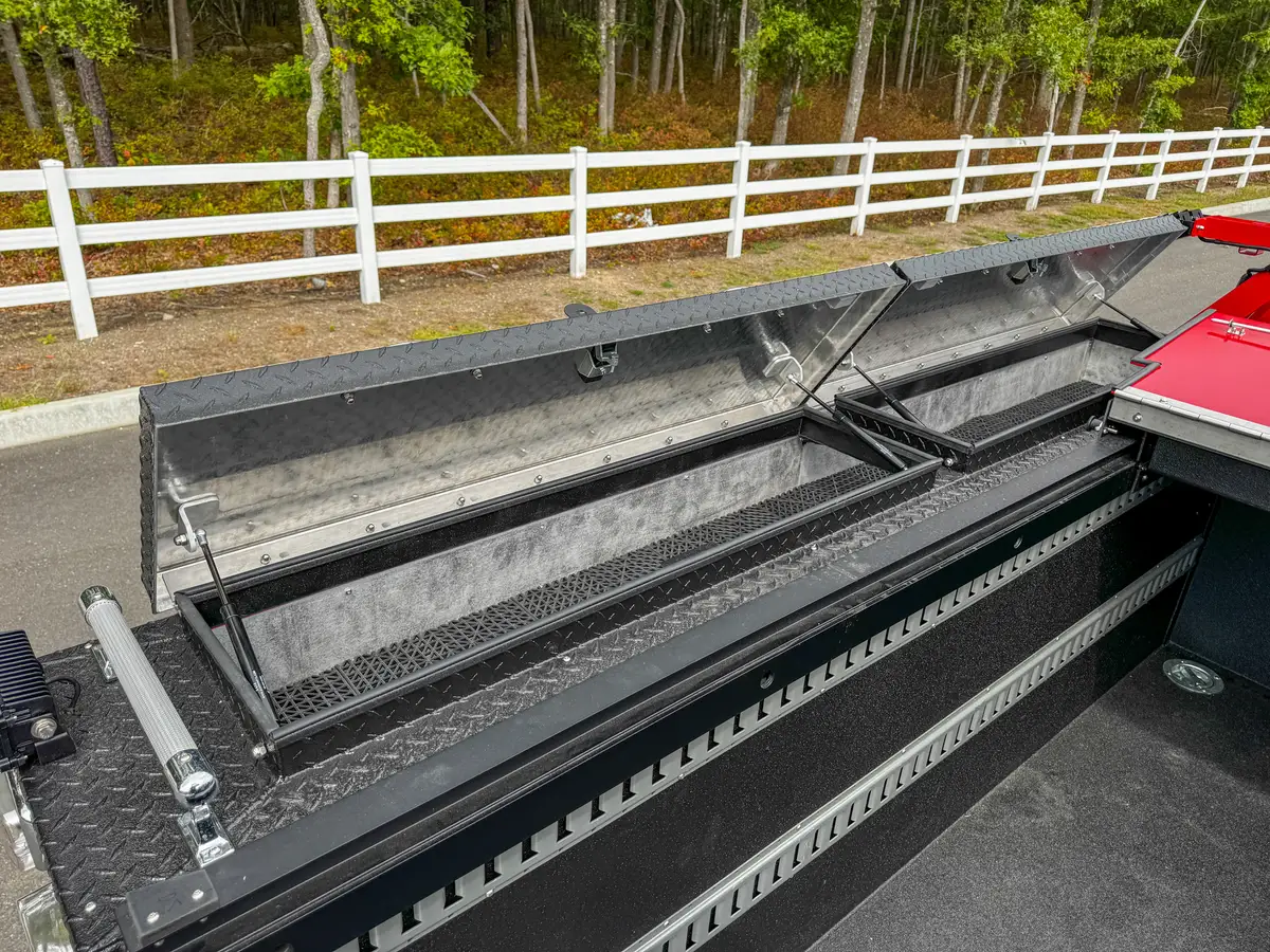 Opposite rail compartment with hinged lid open.