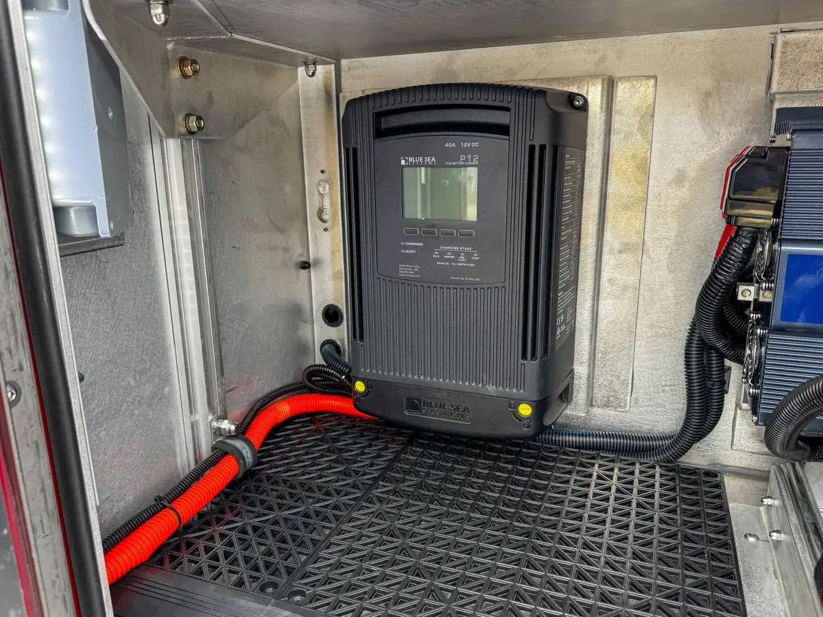 Close-up inside compartment with mounted power components.