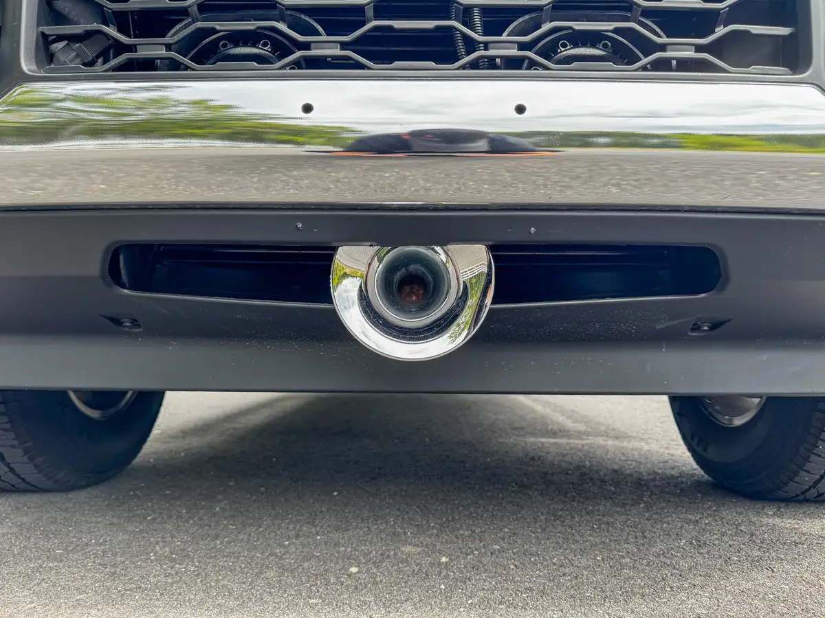 Front bumper tow hook and lower fascia detail.