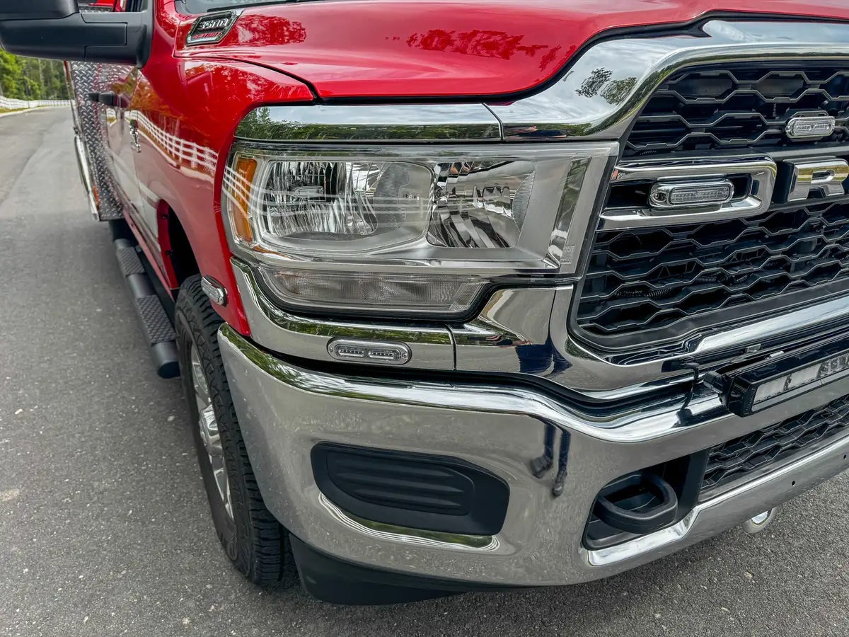 Front driver-side headlight and grille corner close-up.