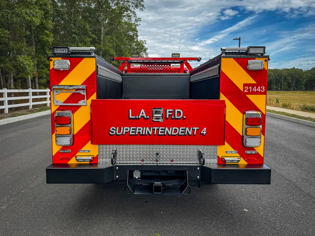 Straight rear view of truck with red-yellow chevron pattern.