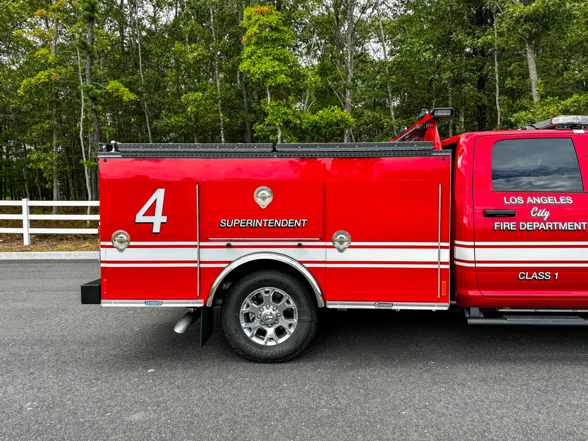 Mid-body side view with unit number and side striping.