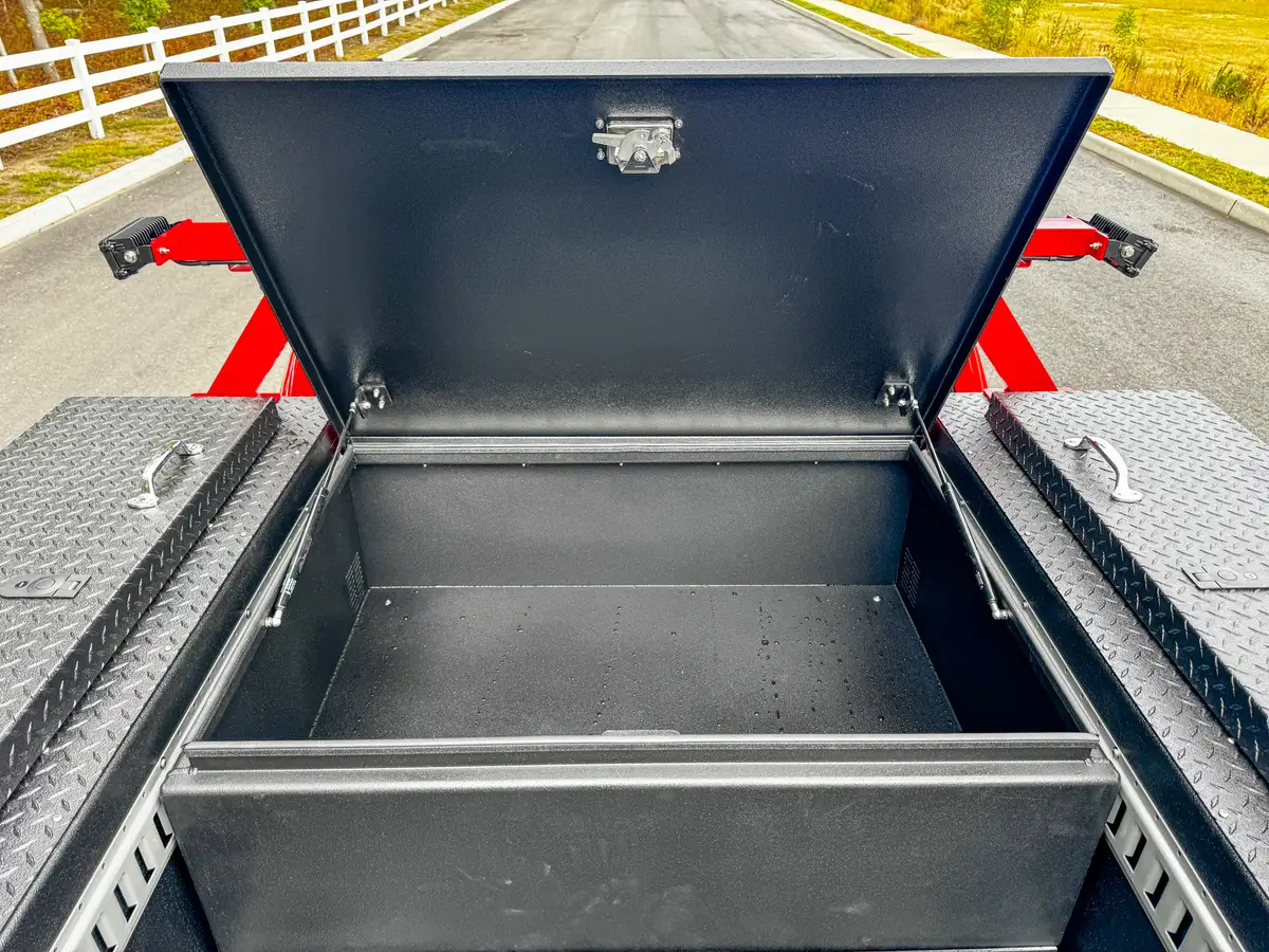 Open front bed box with lid raised.