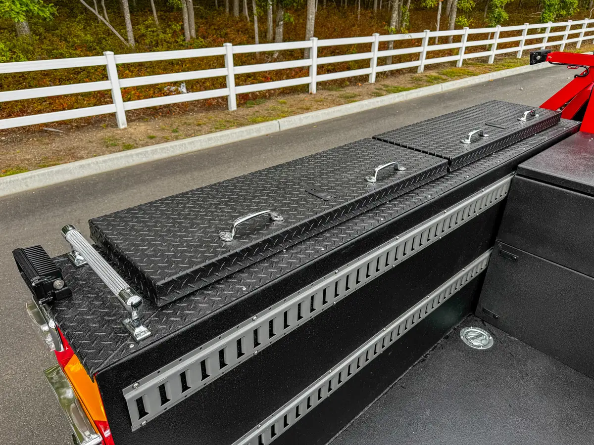 Long side bed rail storage compartment with lid closed.
